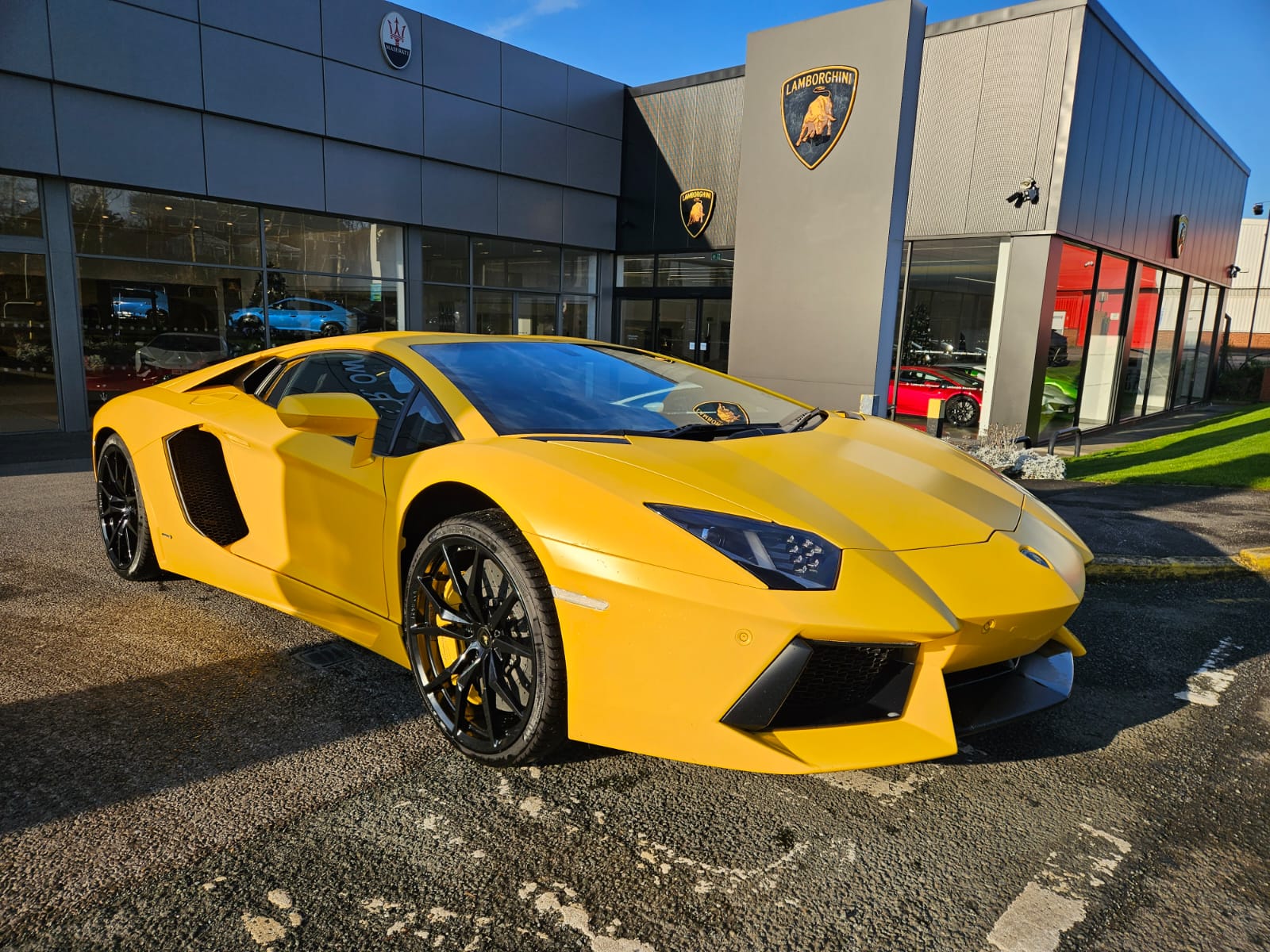 Yellow Lamborghini Aventador loaded for enclosed exotic car transport
